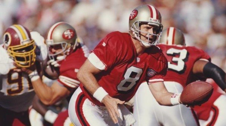 Steve Young handing the ball off (Getty)