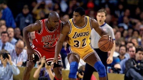 Magic Johnson being guarded by Michael Jordan