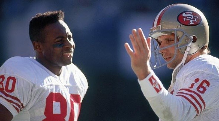 Jerry Rice (left) and Joe Montana during a game. (Getty)