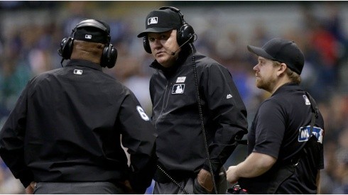 MLB umpires reviewing a call. (Getty)