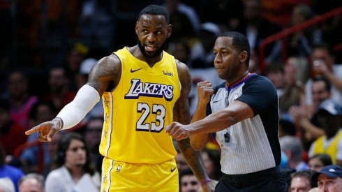 LeBron James arguing with referee Mitchell Ervin. (Getty)