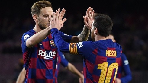 Barcelona's Ivan Rakitic (left) and Lionel Messi celebrate during a match (Getty).
