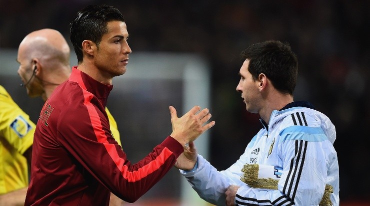 Portugal’s Cristiano Ronaldo (left) shaking hand with Lionel Messi of Argentina (right). (Getty)
