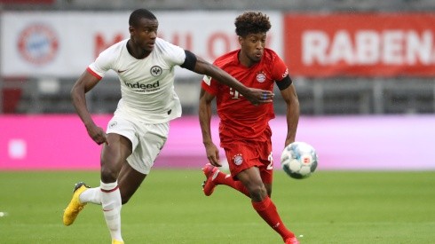 Evan N'dicka of Eintracht Frankfurt (left) battles for possession with Kingsley Coman of Bayern Munich (right. (Getty)
