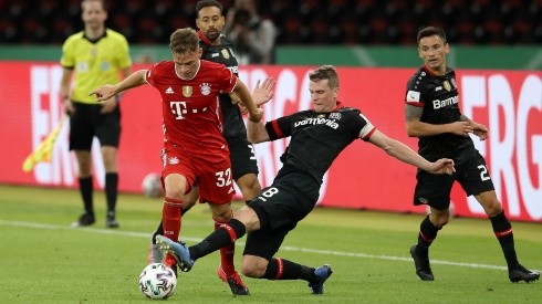 Joshua Kimmich (left) of FC Bayern Muenchen is challenged by Lars Bender of Bayer Leverkusen (right). (Getty)