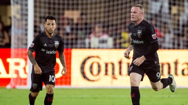 Wayne Rooney and Luciano Acosta