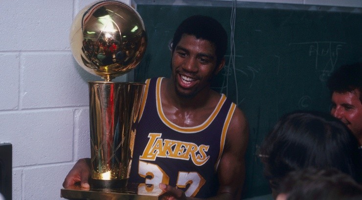 Magic Johnson of the Los Angeles Lakers celebrates the championship trophy in 1980. (Getty)