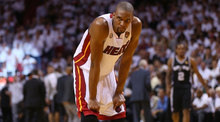 Chris Bosh of the Miami Heat reacts while taking on the San Antonio Spurs. (Getty)
