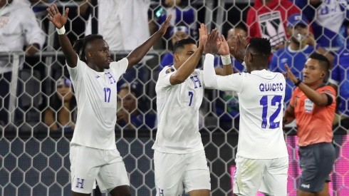 Alberth Elis (left) and Romell Quioto (right) react after a goal by Emilio Izaguirre (centre) of Honduras. (Getty)