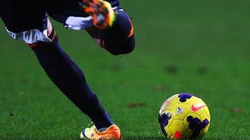 A soccer player kicks the Nike Incyte match ball upfield during a Premier League match. (Getty)