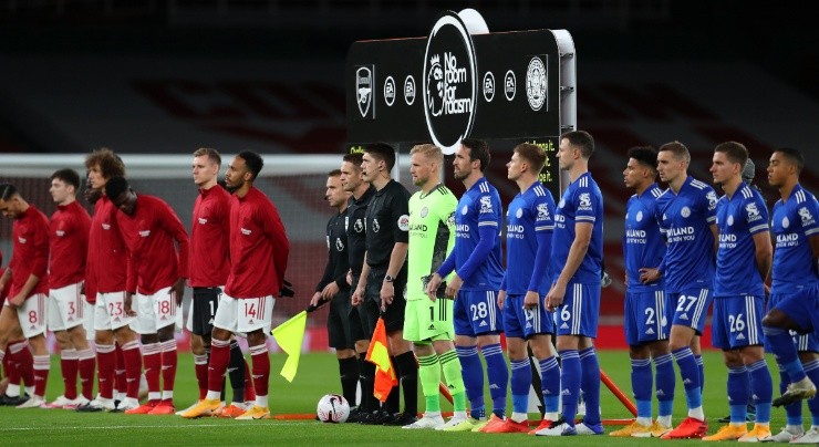The players line up for a handshake ahead of the Premier League match between Arsenal and Leicester City. (Getty)