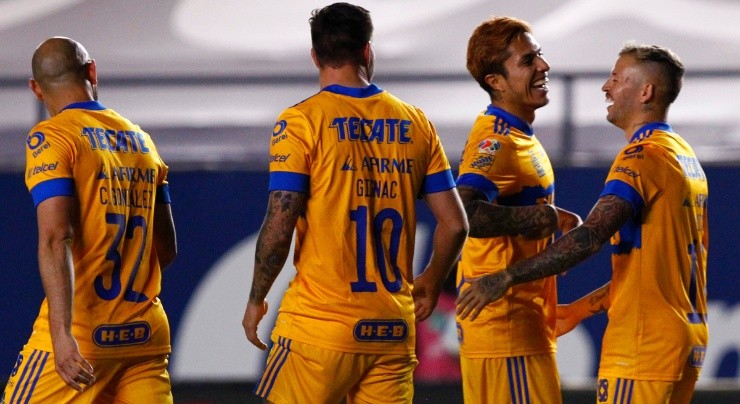 Nicolas Lopez (right) of Tigres UANL celebrates after scoring a goal against Atletico San Luis. (Getty)