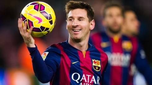 Lionel Messi of Barcelona with the match ball after scoring a hat-trick vs Espanyol in 2014. (Getty)