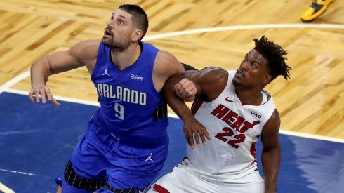 Nikola Vucevic (left) of the Orlando Magic and Jimmy Butler (right) of the Miami Heat. (Getty)