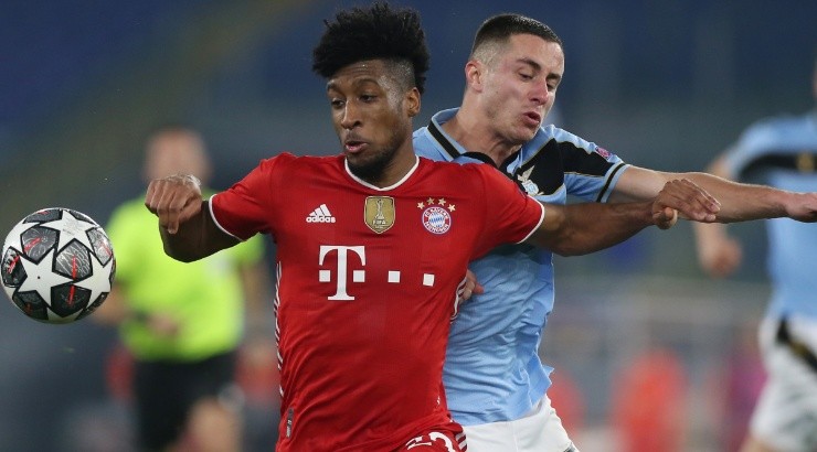 Kingsley Coman of Bayern (left) challenges for the high ball with Adam Marusic of ALzio (right). (Getty)