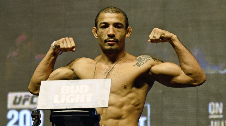 Jose Aldo poses on the scale during his weigh-in (Getty)