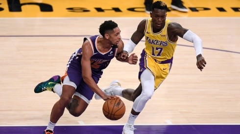 Cameron Payne (left) of the Phoenix Suns dribbles as he is chased by Dennis Schroder (right) of the Los Angeles Lakers