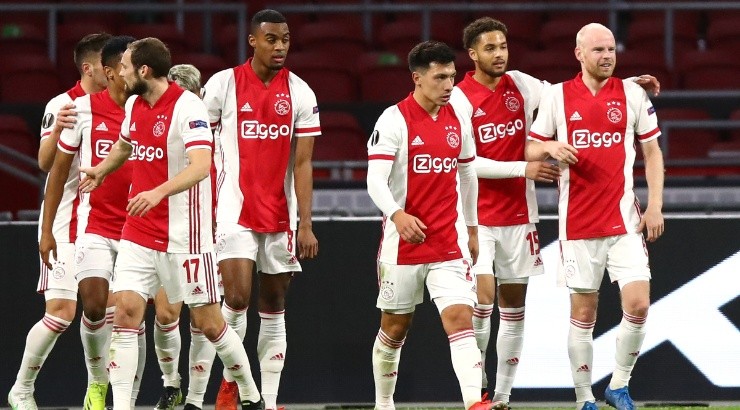 Ajax player Davy Klaassen (right) is congratulated by teammates after scoring vs Lille. (Getty)