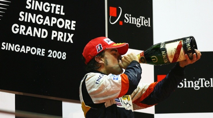 Fernando Alonso of Spain celebrates on the podium after winning the 2008 Singapore Formula One Grand Prix. (Getty)