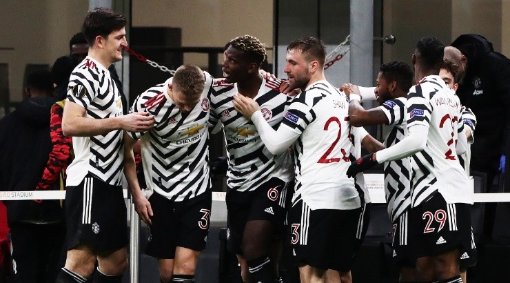 Manchester United players celebrate after a goal against Milan. (Getty)