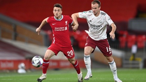 Diogo Jota of Liverpool (left) is challenged by Rob Holding of Arsenal (right).