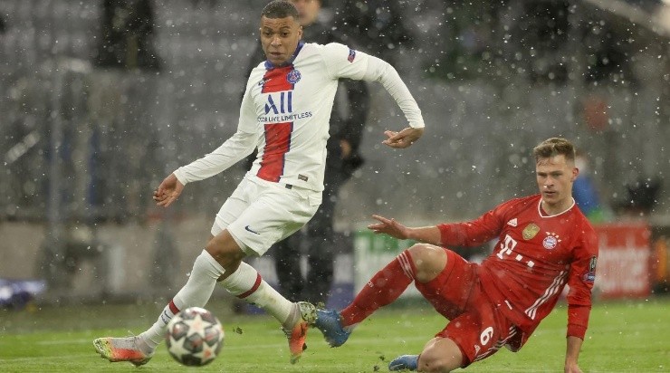 Kylian Mbappe of Paris Saint-Germain breaks away from Joshua Kimmich of FC Bayern Munich during the UEFA Champions League Quarter Final (Getty)
