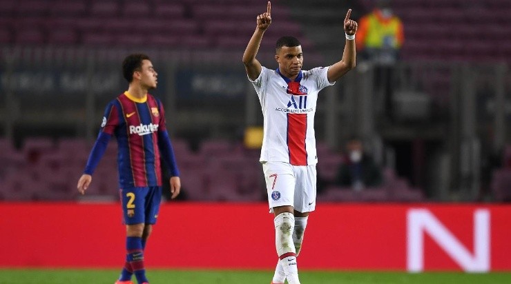 Kylian Mbappe of Paris Saint-Germain celebrates after scoring their side’s first goal during the UEFA Champions League Round of 16 match between FC Barcelona and Paris Saint-Germain (Getty)