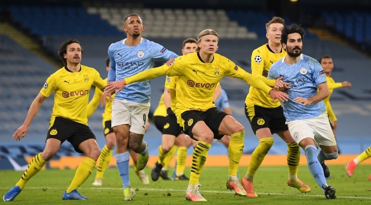 Erling Haaland (center) of Borussia Dortmund battles with Gabriel Jesus (left) and Ilkay Guendogan (right) of Manchester City. (Getty)
