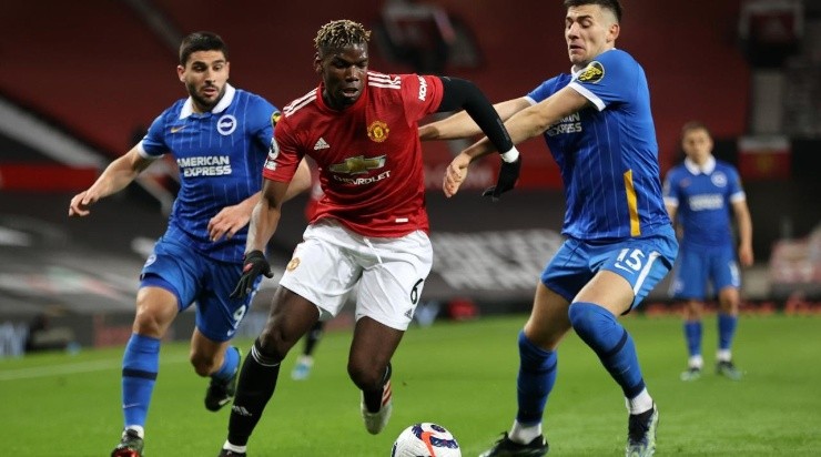 Paul Pogba of Manchester United battles for possession with Jakub Moder (R) and Neal Maupay (L) of Brighton &amp; Hove Albion during the Premier League match between Manchester United and Brighton &amp; Hove Albion at Old Trafford. (Getty)