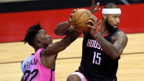 DeMarcus Cousins (right) of the Houston Rockets controls the ball under pressure from Jimmy Butler (left) of the Miami Heat. (Getty)