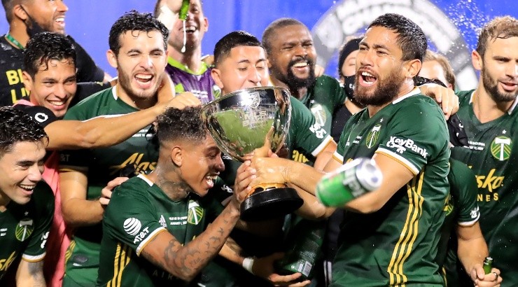 Portland Timbers celebrate with the 2020 MLS Is Back champions trophy. (Getty)