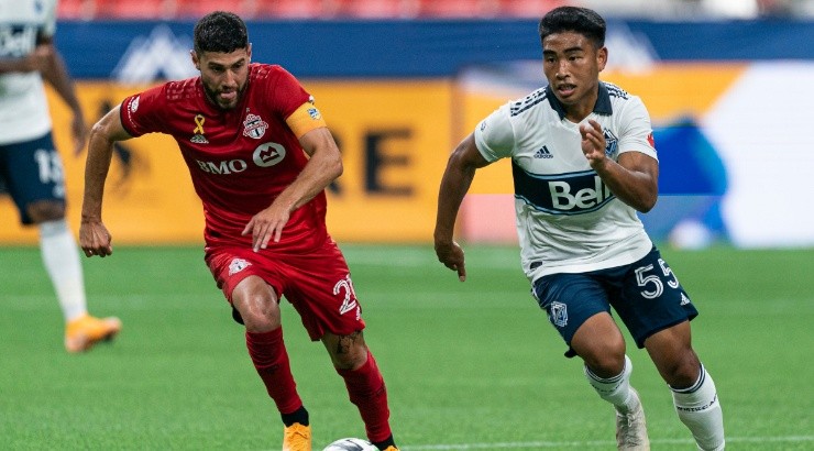 Michael Baldisimo (right) of the Vancouver Whitecaps and Jonathan Osorio (left) of the Toronto FC. (Getty)