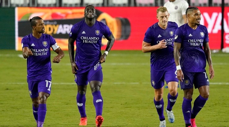 Orlando City SC players react after scoring a goal. (Getty)