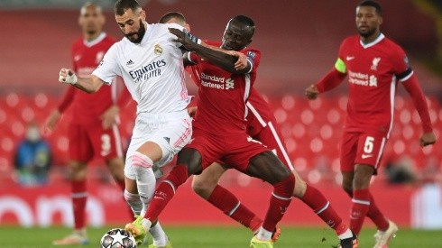 Karim Benzema of Real Madrid is challenged by Sadio Mane of Liverpool during the UEFA Champions League Quarter Final Second Leg match between Liverpool FC and Real Madrid (Getty)
