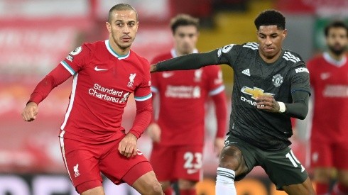 Thiago Alcantara of Liverpool (left) battles for possession with Marcus Rashford of Manchester United (right). (Getty)