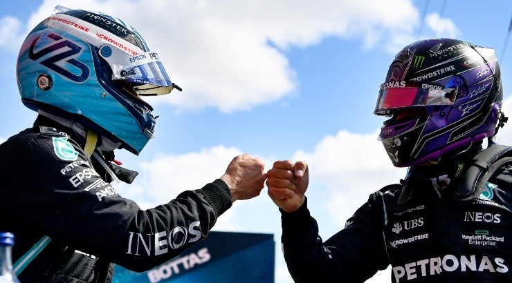 Valtteri Bottas (left) interacts with teammate Lewis Hamilton of Mercedes (right). (Getty)