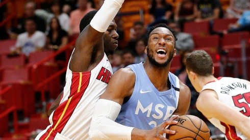 Josh Okogie (right) of the Minnesota Timberwolves drives to the basket against Kendrick Nunn (left) of the Miami Heat. (Getty)
