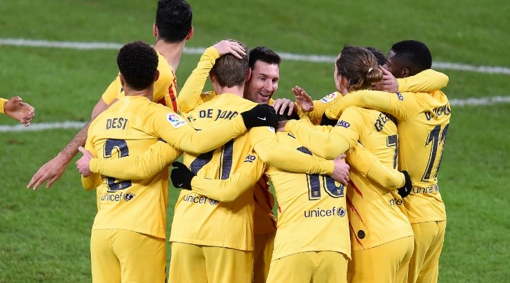 Pedri celebrates with Lionel Messi of Barcelona. (Getty)