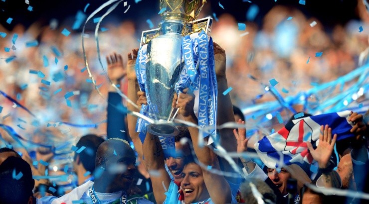 Sergio Aguero of Manchester City celebrates with the 2011-12 Premier League Trophy. (Getty)