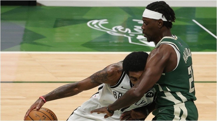 Jrue Holiday guards Kyrie Irving. (Getty)
