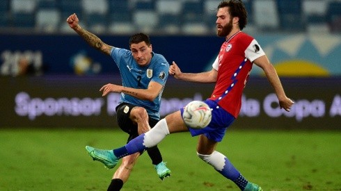 Jose Gimenez of Uruguay competes for the ball with Ben Brereton of Chile (Getty)