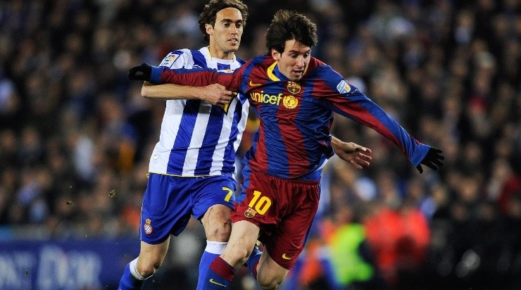 Lionel Messi (R) of Barcelona competes for the ball with Raul Baena of Espanyol (Getty)