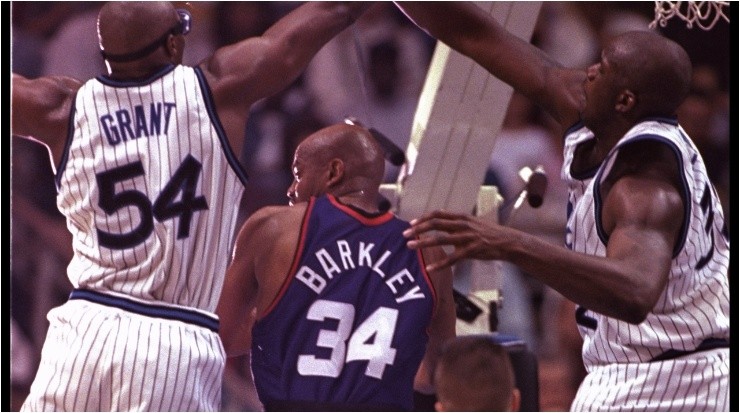 Horace Grant and Shaquille O’Neal guarding Charles Barkley. (Getty)