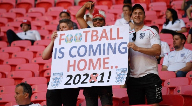 England fans with a sign saying Football is coming home 2021. (Getty)