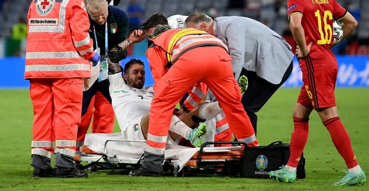 Leonardo Spinazzola of Italy is helped by medical staff onto a stretcher. (Getty)