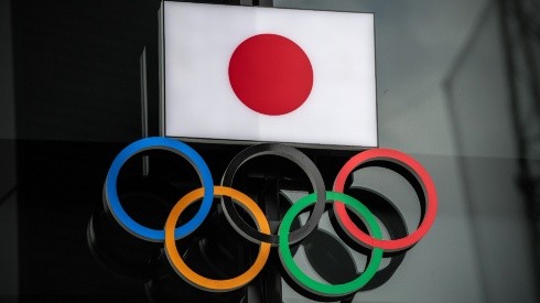 The Japanese flag is displayed over the Olympic Rings. (Getty)