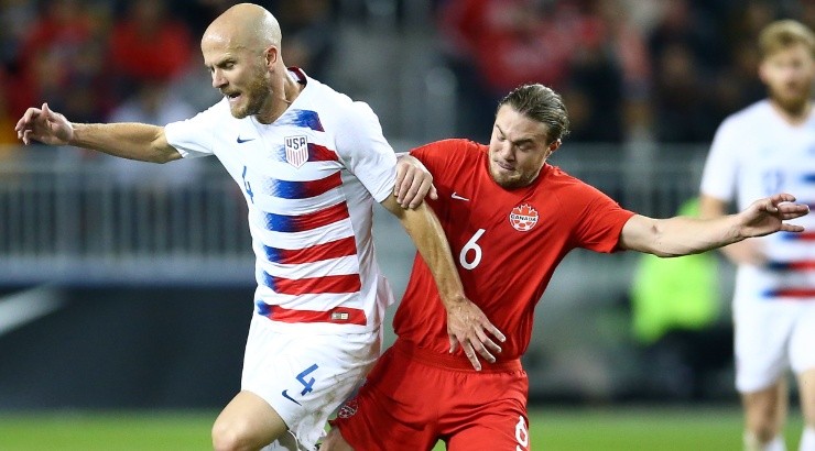 Michael Bradley of the USMNT (left) battles for the ball with Samuel Piette of Canada (right) in 2019. (Getty)