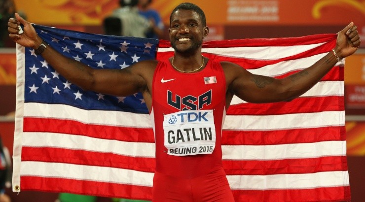 Justin Gatlin of the United States celebrates with the US flag. (Getty)