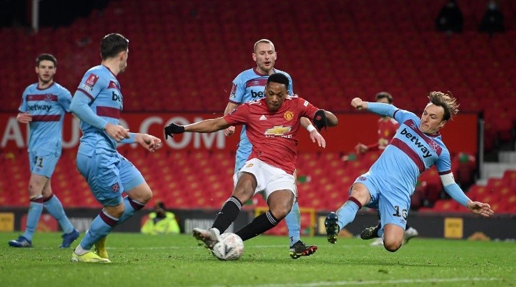 Anthony Martial of Manchester United shoots under pressure from Mark Noble of West Ham (Getty)
