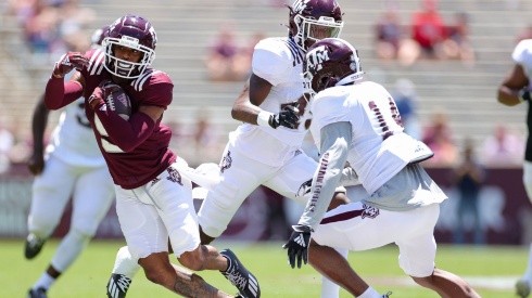 Hezekiah Jones #9 of the Texas A&M Aggies rushes ahead of Keldrick Carper #14 during the first half of the spring game at Kyle Field on April 24, 2021 in College Station, Texas.  (Getty)